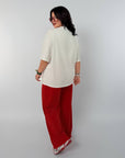 Трикотажен комплект с надпис, модел NewYear25, и състав 80% памук, 15% полиестер, 5% еластан, българско производство.
