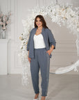 Комплект ленени панталони с декоративни камъни и ленти, произведени от 80% лен и 20% полиестер, за стилен вид.