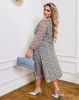 Floral chiffon dress featuring lightweight fabric and a flowing silhouette, made from 50% viscose and 50% polyester.