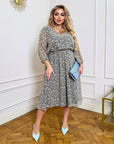 Light floral chiffon dress with a flowing silhouette, made from 50% viscose and 50% polyester, shown on a hanger.