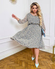 Flowy chiffon floral dress with lightweight fabric, featuring a feminine silhouette and vibrant flower print.
